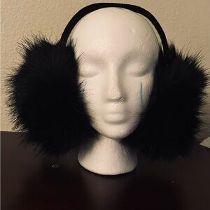 Faux Fur Black Earmuffs with suedearound the top comes in pink, tan red pink